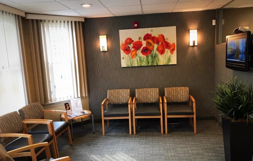 Empty chairs in dental office reception area
