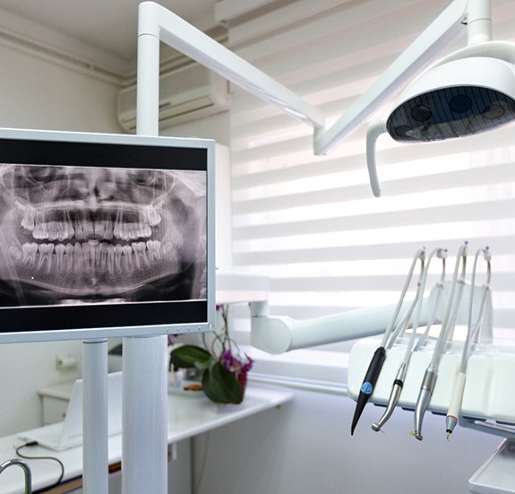 a dental operatory with an X-ray on a monitor