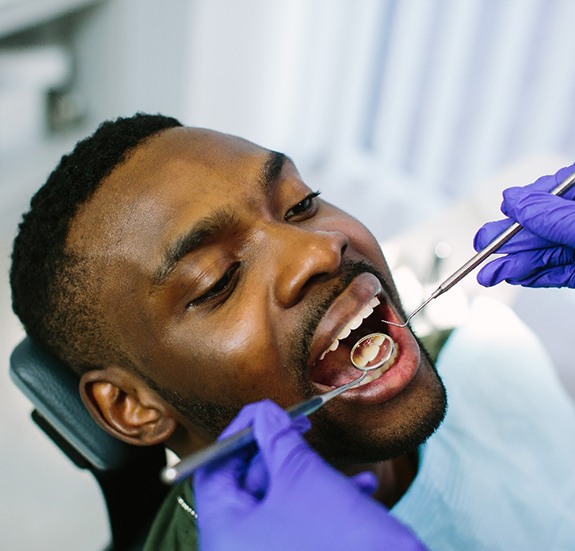 a patient receiving a dental cleaning