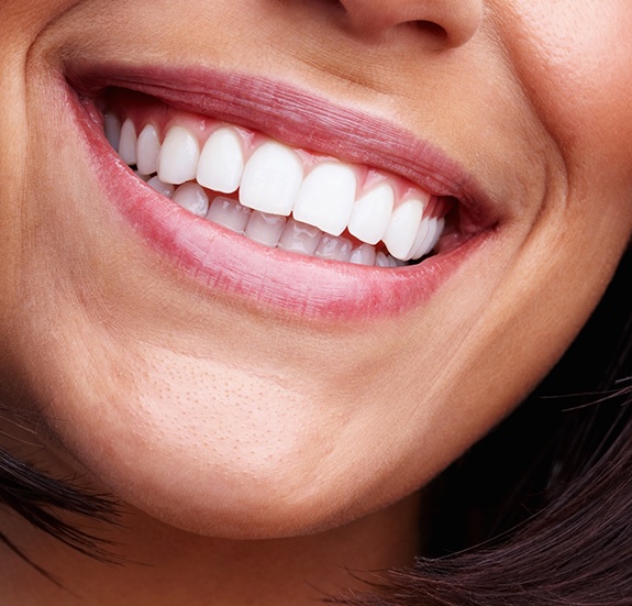 Close up of person with straight white teeth smiling