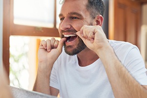 Man calling to schedule an appointment with his dentist
