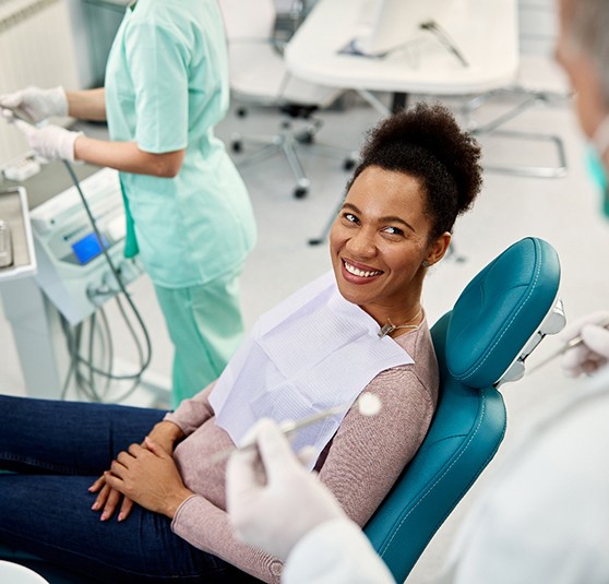 Young female smiling with new dental implants in Revere