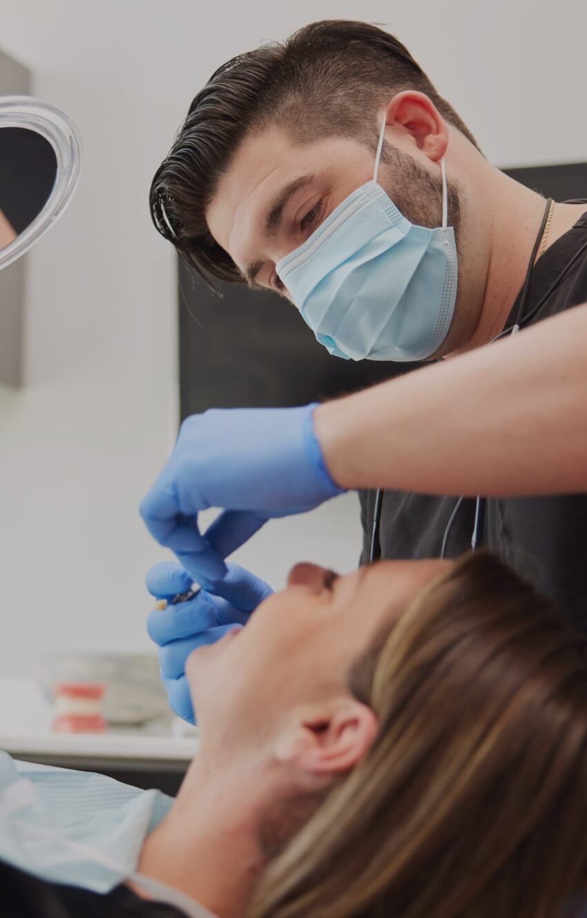 Close up of dentist treating a patient