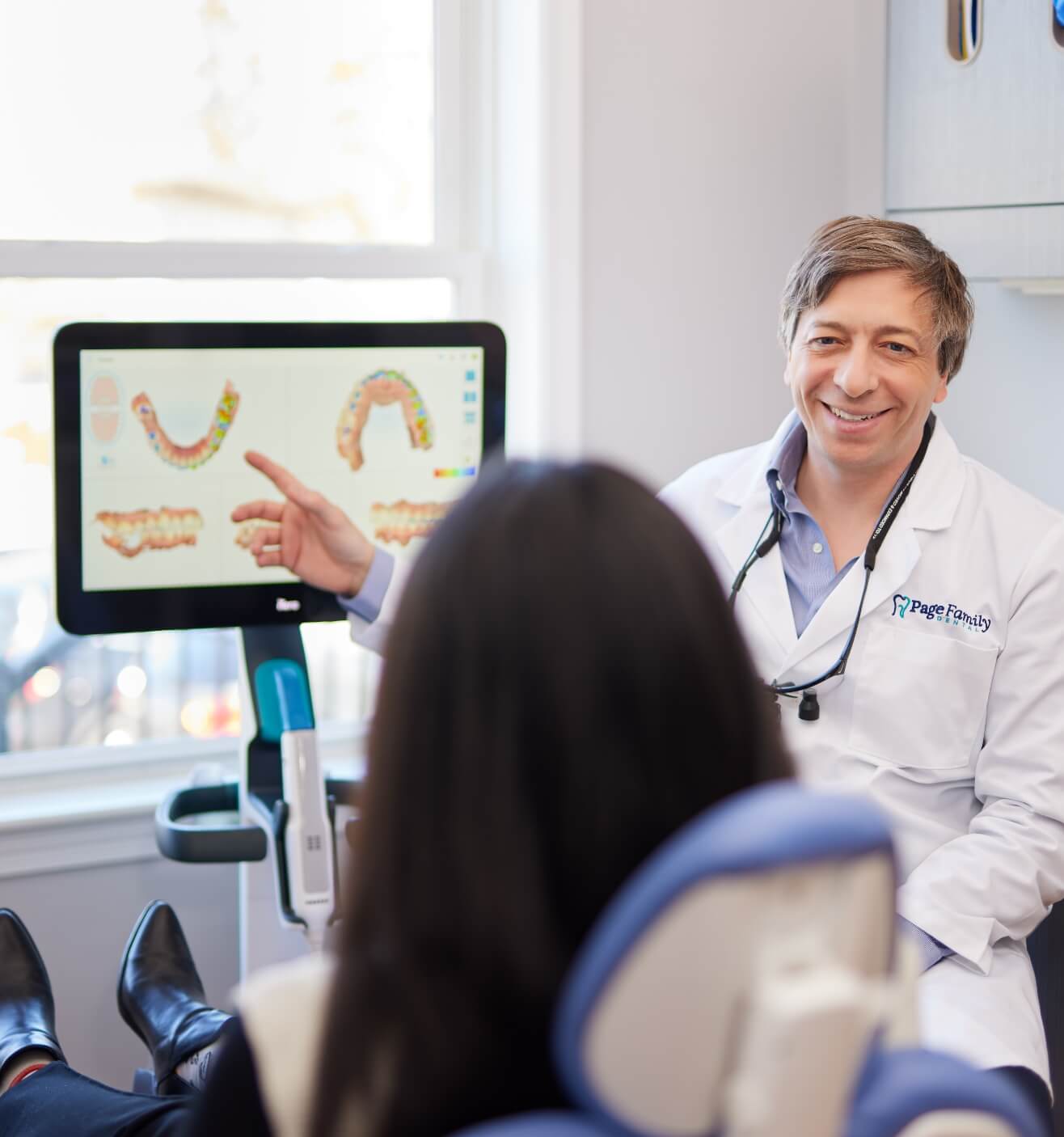 dentist talking with patient