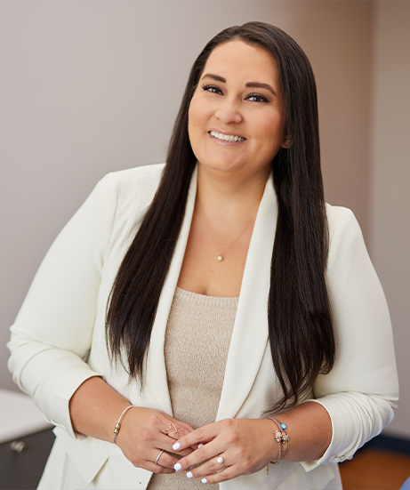 Dental administrative director Carolina in white suit jacket